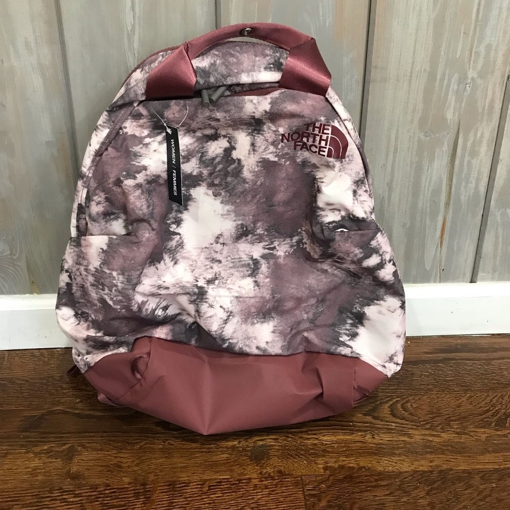 The North Face daypack. New with tags. Rose pink multi colored.